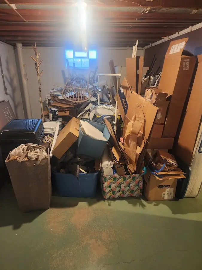 Roll-off dumpster container at job site for 2 Yard Dumpster Rental in Stanley